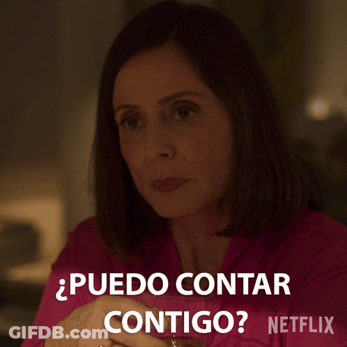A Woman In A Pink Shirt Says " Puedo Contar Contigo " In Spanish GIF