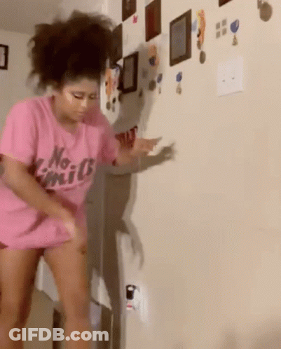 A Woman In A Pink Shirt That Says No Limits GIF