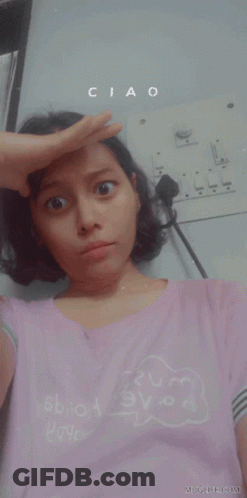 A Woman In A Pink Shirt With The Word Nope On It GIF
