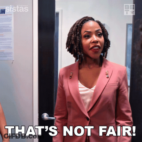 A Woman In A Pink Suit Has The Words That 'S Not Fair On Her Chest GIF