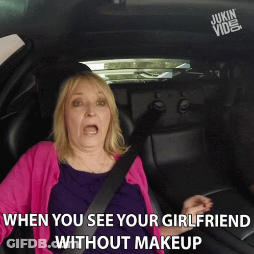 A Woman In A Pink Sweater Is Sitting In A Car With A Caption That Says When You See Your Girlfriend Without Makeup GIF