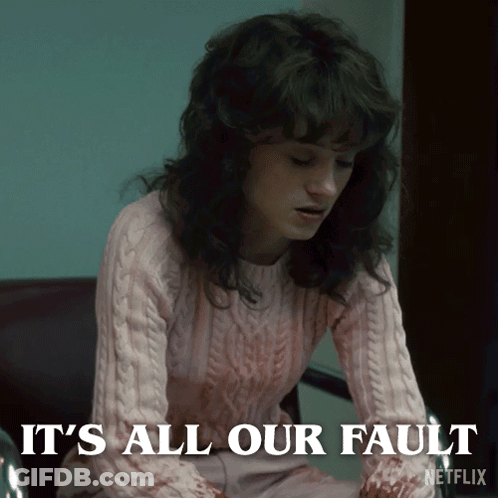 A Woman In A Pink Sweater Says It 'S All Our Fault On The Screen GIF