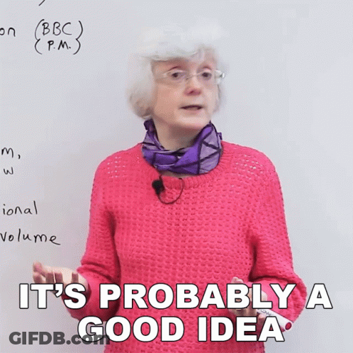 A Woman In A Pink Sweater Says It 'S Probably A Good Idea In Front Of A White Board GIF