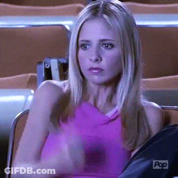Woman In Pink Tank Sitting In Chairs GIF