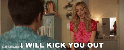 A Woman In A Pink Tie Dye Shirt Stands Next To A Man And Says I Will Kick You Out GIF