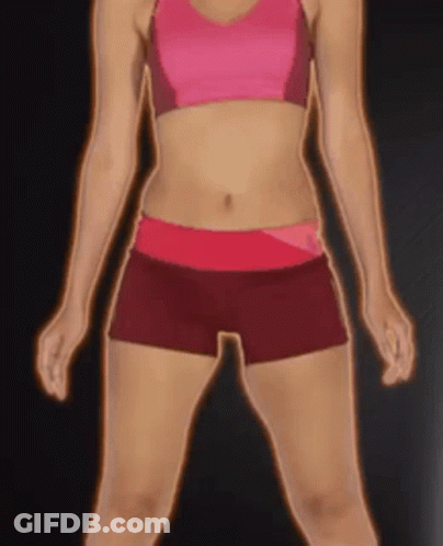 A Woman In A Pink Top And Red Shorts Stands In Front Of A Black Background GIF