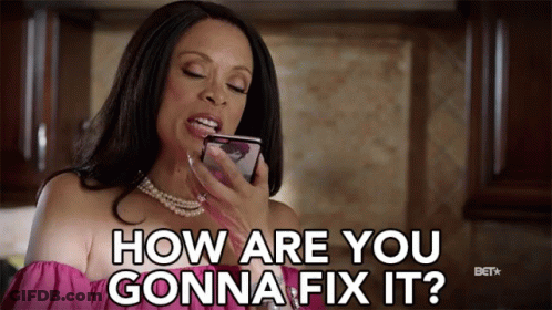 A Woman In A Pink Top Is Holding A Cell Phone And Says How Are You Gonna Fix It GIF