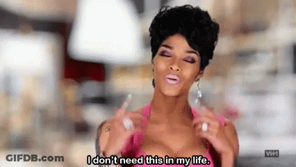 A Woman In A Pink Top Is Saying `` I Don 'T Need This In My Life '' . GIF