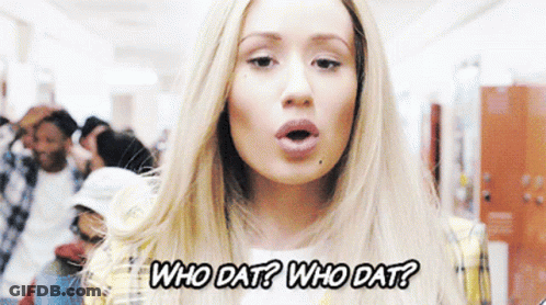 A Woman In A Plaid Jacket Is Asking Who Dat GIF