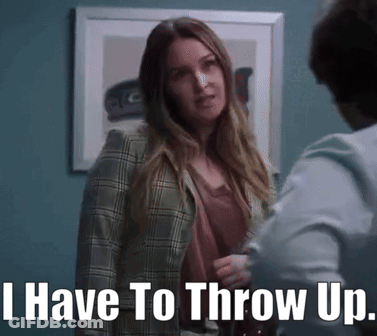 A Woman In A Plaid Jacket Is Standing Next To A Man And Says I Have To Throw Up GIF