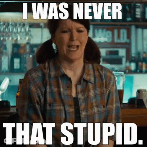 A Woman In A Plaid Shirt Is Sitting At A Bar With A Caption That Says I Was Never That Stupid GIF