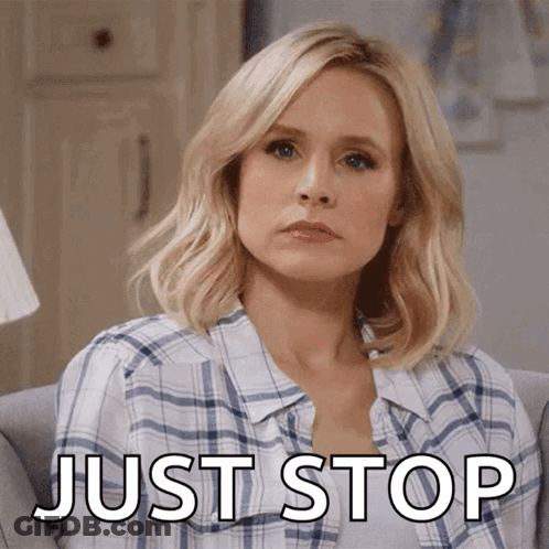 A Woman In A Plaid Shirt Is Sitting On A Couch With The Words Just Stop Below Her GIF