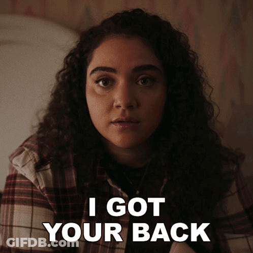 A Woman In A Plaid Shirt Says " I Got Your Back " In White Letters GIF