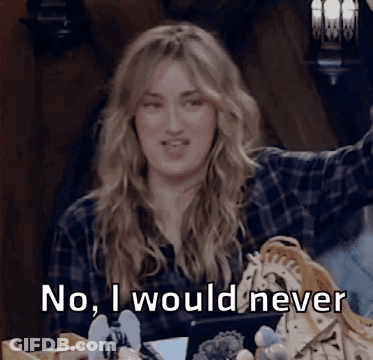 A Woman In A Plaid Shirt Says " No I Would Never " While Sitting At A Table GIF