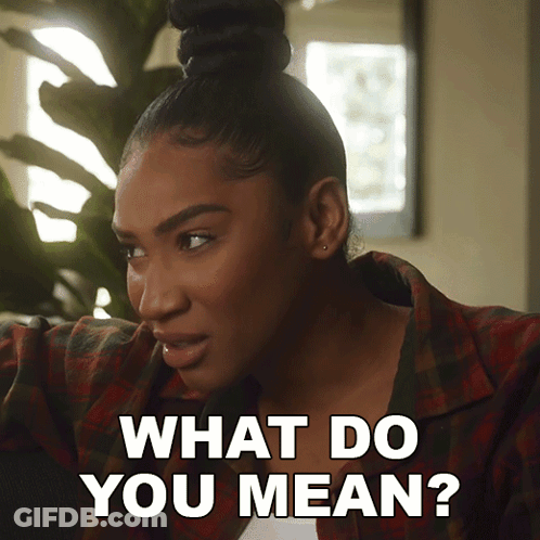 A Woman In A Plaid Shirt Says " What Do You Mean " GIF