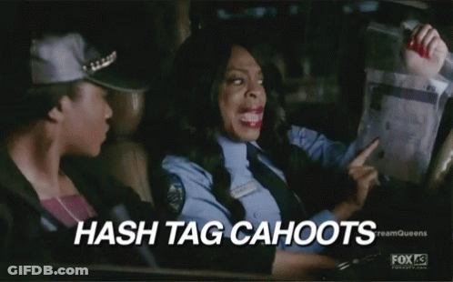 A Woman In A Police Uniform Is Driving A Car While Another Woman Looks Out The Window . GIF