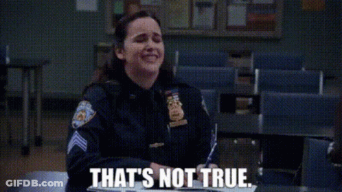 A Woman In A Police Uniform Is Sitting At A Desk In A Classroom And Saying `` That 'S Not True '' . GIF