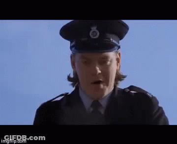 A Woman In A Police Uniform Is Standing In Front Of A Blue Sky And Says Well Well Well . GIF