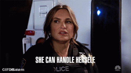 A Woman In A Police Uniform Says She Can Handle Herself In Front Of An Ambulance GIF