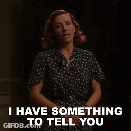 A Woman In A Polka Dot Dress Says I Have Something To Tell You . GIF