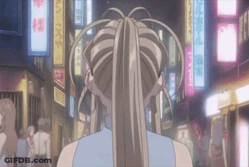 A Woman In A Ponytail Is Walking Down A Street With A Sign That Says ' A ' On It GIF
