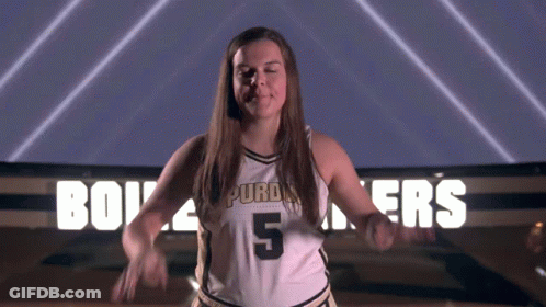 A Woman In A Purdue Jersey Number 5 GIF