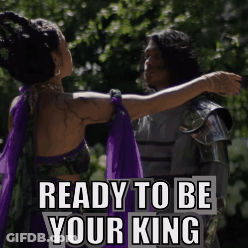 A Woman In A Purple Dress Is Hugging A Man In Armor With The Words " Ready To Be Your King " Above Them GIF