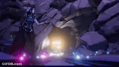 A Woman In A Purple Dress Is Standing In A Cave Surrounded By Rocks And Purple Lights . GIF