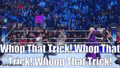 A Woman In A Purple Dress Is Standing In A Wrestling Ring With The Words Whoop That Trick Whoop That Trick GIF