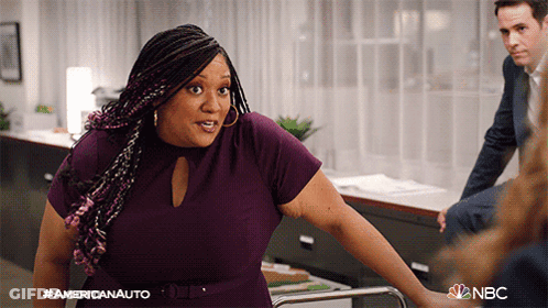 Woman In Purple Dress In Front Of Americanauto Sign GIF