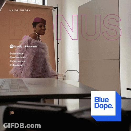 A Woman In A Purple Dress Is Standing In Front Of A Poster That Says Major Theory GIF