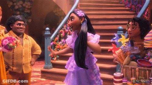 A Woman In A Purple Dress With A Flower In Her Hair Stands In Front Of Stairs GIF