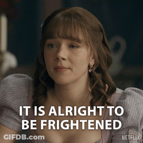 A Woman In A Purple Dress With The Words It Is Alright To Be Frightened GIF