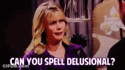 A Woman In A Purple Jacket Is Talking To A Man In A Room And Asking Him If He Can Spell Delusional . GIF