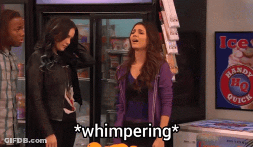 A Woman In A Purple Jacket Stands In Front Of A Handy Ho Quick Sign GIF