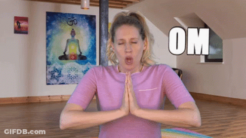 A Woman In A Purple Shirt Is Meditating With The Word Om Above Her GIF