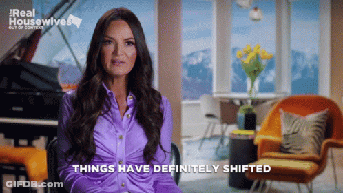 A Woman In A Purple Shirt Says Things Have Definitely Shifted In Front Of A Piano GIF