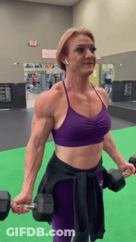 Woman In Purple Sports Bra Lifting Dumbbells GIF