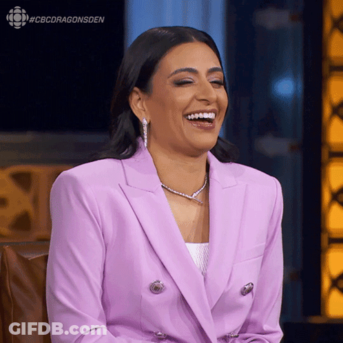 A Woman In A Purple Suit Is Laughing With The Hashtag #Cbcdragonsden Above Her GIF