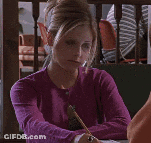 A Woman In A Purple Sweater Is Sitting At A Table And Says " You 'Re Not Stupid " GIF