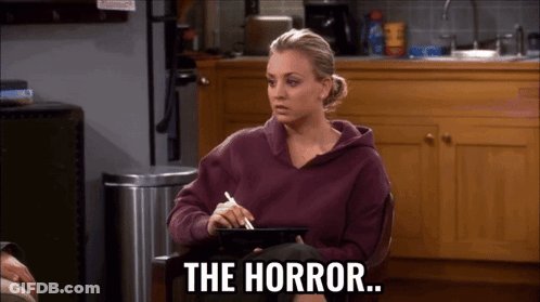Woman In Purple Sweatshirt Holding Tablet Says The Horror GIF