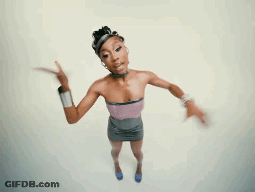 A Woman In A Purple Top And Gray Skirt Is Pointing GIF