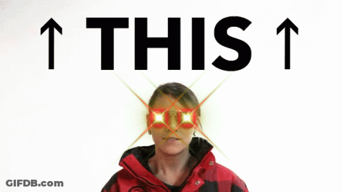 Woman In Red And Black Jacket Pointing Up Behind The Words This GIF