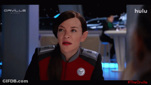 A Woman In A Red And Black Uniform With The Word Orville On The Top Left GIF
