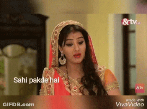 A Woman In A Red And Gold Dress With The Words Sahi Pakde Hai GIF