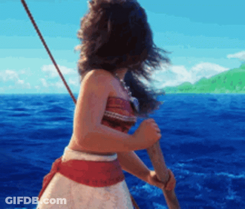 A Woman In A Red And White Dress Is Holding A Paddle In The Ocean . GIF