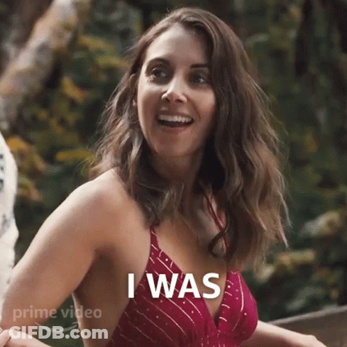 A Woman In A Red Bikini Top Is Smiling And Saying I Was . GIF