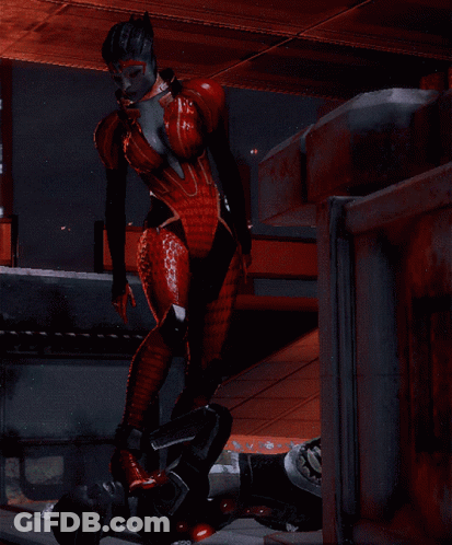 A Woman In A Red Bodysuit Is Standing Next To A Man In A Black Suit GIF