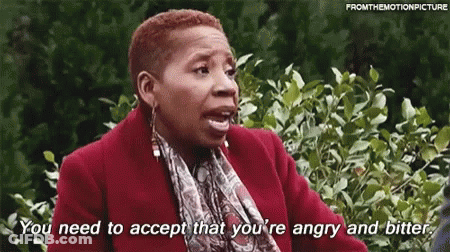 A Woman In A Red Coat And Scarf Is Saying `` You Need To Accept That You 'Re Angry And Bitter '' GIF