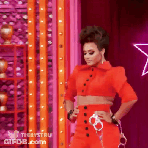 Woman In Red Crop Top And Pants On Stage GIF